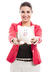 Image showing Business woman with a piggy bank