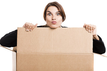 Image showing Business woman appear inside a big card box