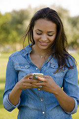 Image showing Beautiful woman texting