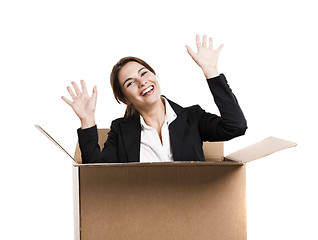 Image showing Business woman appear inside a big card box