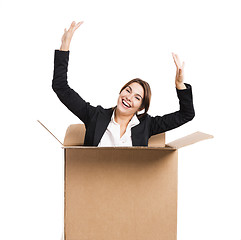 Image showing Business woman appear inside a big card box