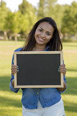 Image showing Beautiful woman holding a shalkboard