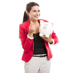 Image showing Business woman with a piggy bank