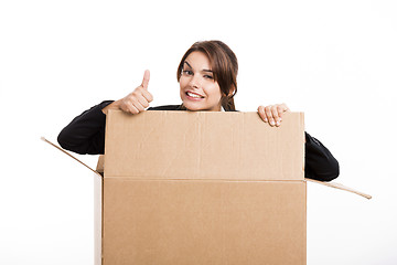 Image showing Business woman appear inside a big card box
