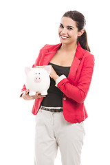 Image showing Business woman with a piggy bank