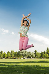 Image showing Beautiful African American woman jumping