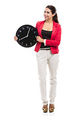 Image showing Business woman holding a clock