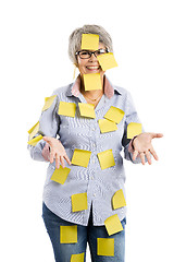 Image showing Elderly woman with yellow notes