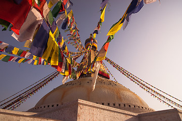 Image showing Colorful Prayer flags and Boudhanath stupa in Kathmandu