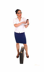 Image showing Business women dialling.