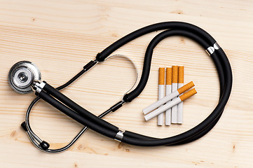 Image showing Stethoscope and cigarette 