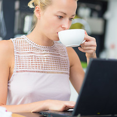 Image showing Business woman working from home.
