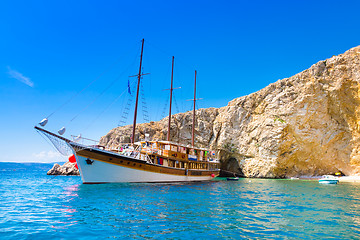 Image showing Vintage sailing boat in bay.