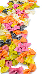 Image showing Colored farfalle pasta, on the left edge