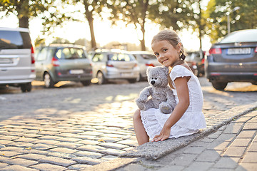 Image showing Young lonely girl on a city street