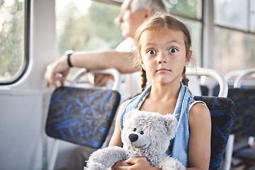 Image showing Funny open eyed girl in a tram