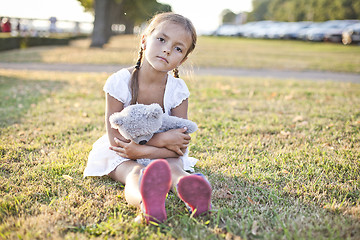 Image showing Sad child in a park