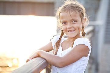 Image showing Happy young girl in a city