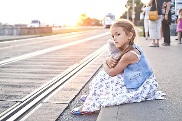 Image showing Lonely girl on a city tram station