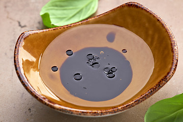 Image showing Bowl of oil and balsamic vinegar