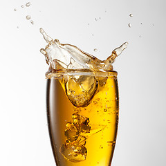 Image showing Beer splash in glass isolated on white