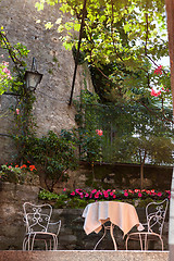 Image showing table and chairs in italian garden