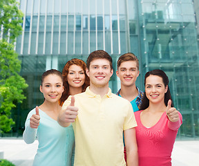 Image showing group of smiling teenagers over city background