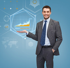 Image showing businessman showing graph on virtual screen