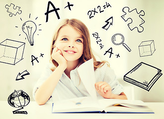 Image showing little student girl studying at school