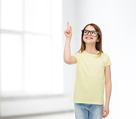 Image showing smiling cute little girl in black eyeglasses