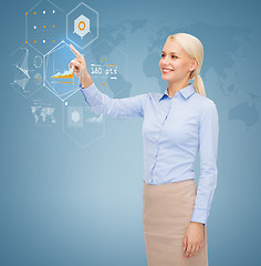 Image showing smiling businesswoman working with virtual screen