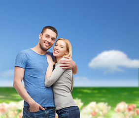 Image showing smiling couple hugging