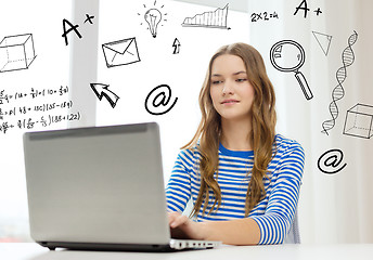 Image showing smiling teenage gitl with laptop computer at home