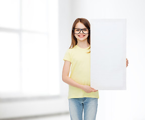 Image showing little girl wearing eyeglasses with blank board