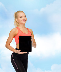 Image showing smiling woman showing tablet pc blank screen