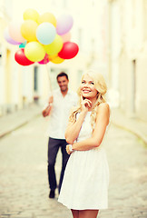 Image showing couple with colorful balloons