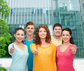 Image showing group of smiling teenagers over city background