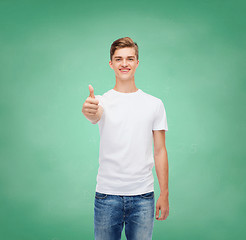 Image showing smiling man in white t-shirt showing thumbs up