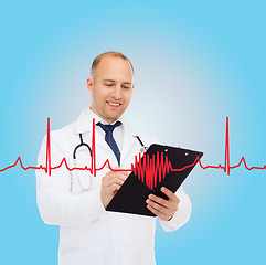 Image showing smiling male doctor with clipboard and stethoscope