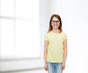 Image showing smiling cute little girl in black eyeglasses