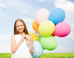 Image showing happy girl with colorful balloons