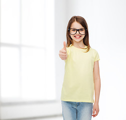 Image showing smiling cute little girl in black eyeglasses