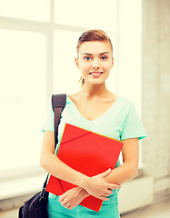 Image showing student girl with school bag and color folders