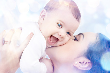 Image showing happy mother kissing baby