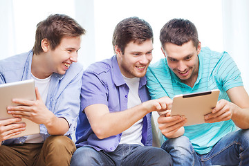 Image showing smiling friends with tablet pc computers at home