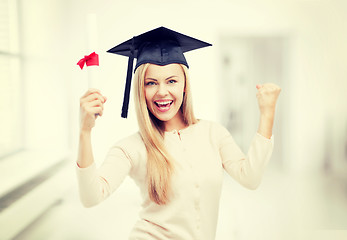 Image showing student in graduation cap with certificate