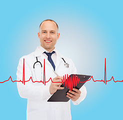 Image showing smiling male doctor with clipboard and stethoscope