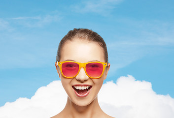 Image showing happy teenage girl in pink sunglasses