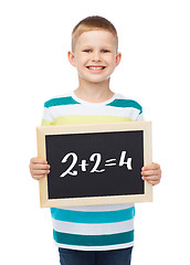 Image showing smiling little boy with blank blackboard