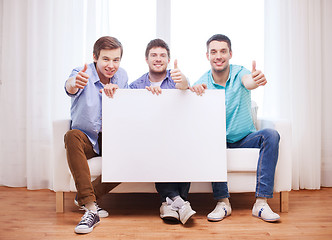 Image showing happy male friends with blank white board